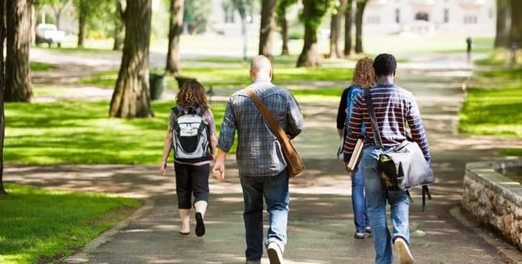 A family walking along a park path
